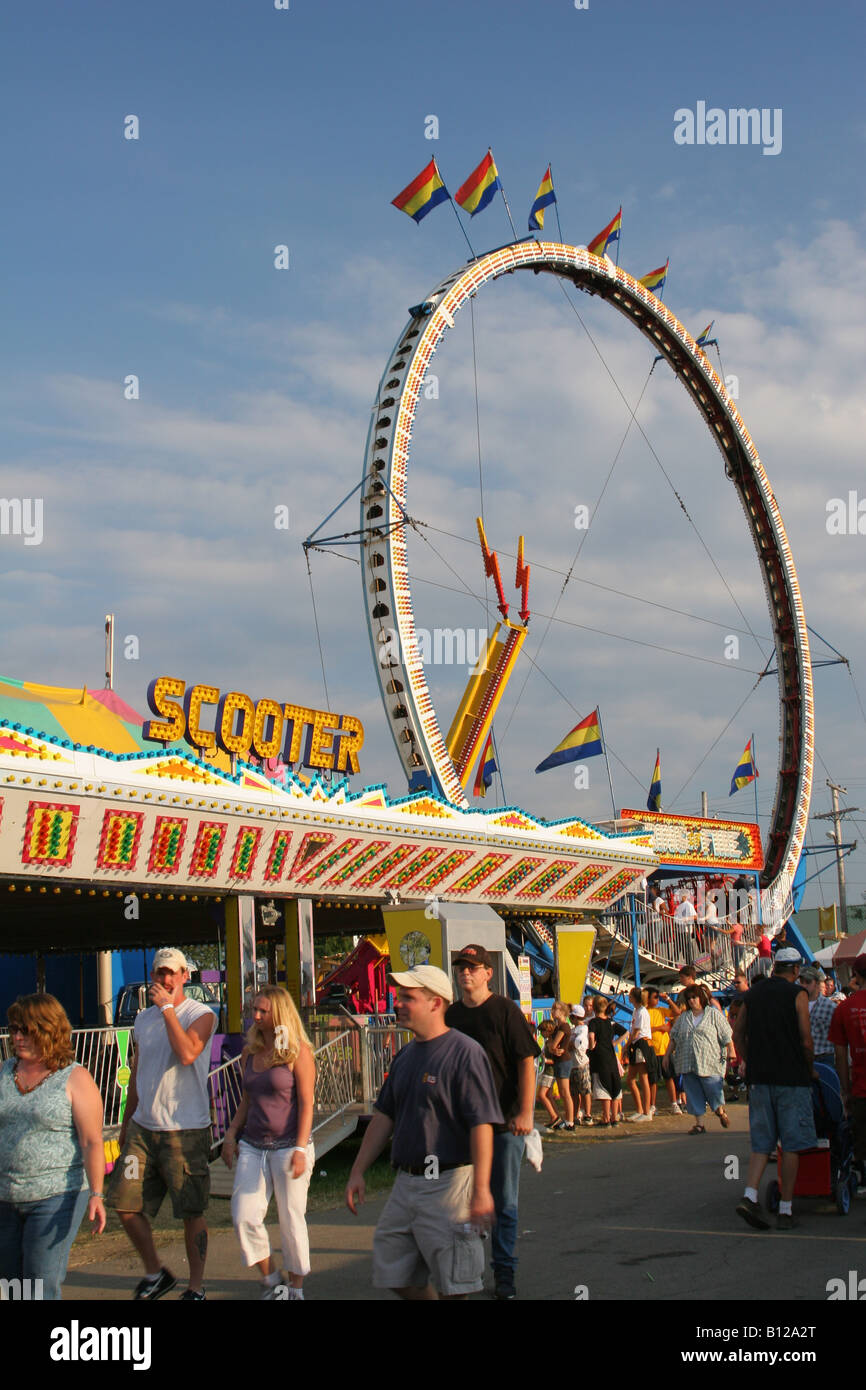 Carnival Rides named Scooter or Bumper Cars and Ring Of Fire beyond Canfield Fair Canfield Ohio