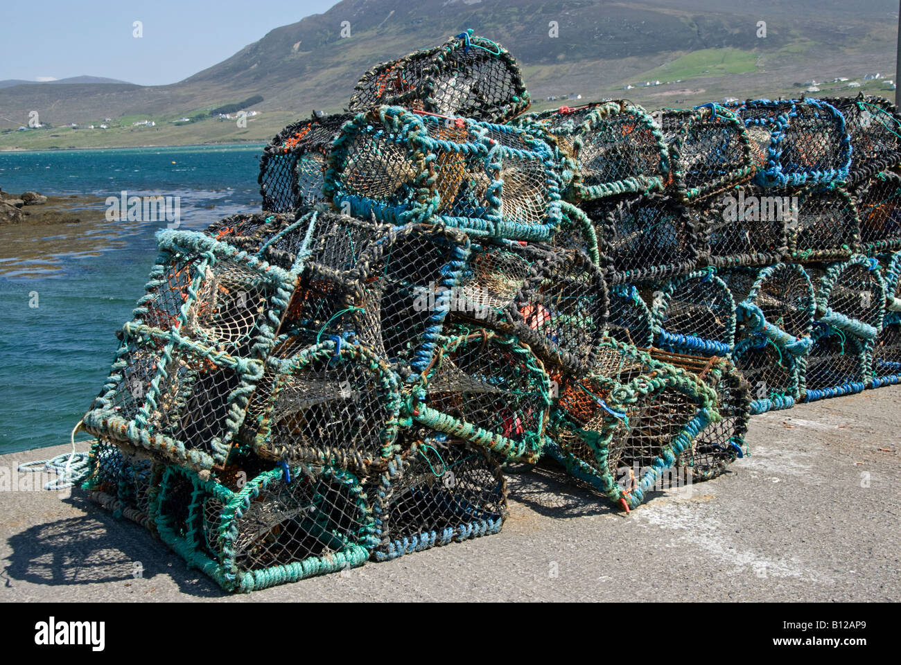 Lobster pots on harbour side. Achill Island, County Mayo, Ireland Stock