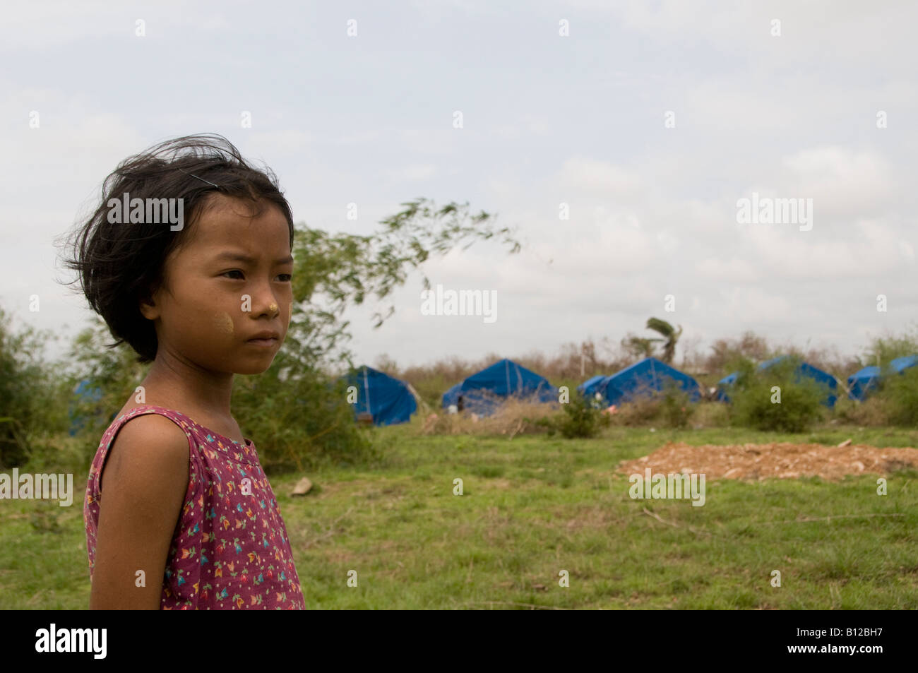 Young girl in a relief encampment set up by the government for cyclone Nargis victims in Kyauktan township of Yangon Myanmar Burma Stock Photo