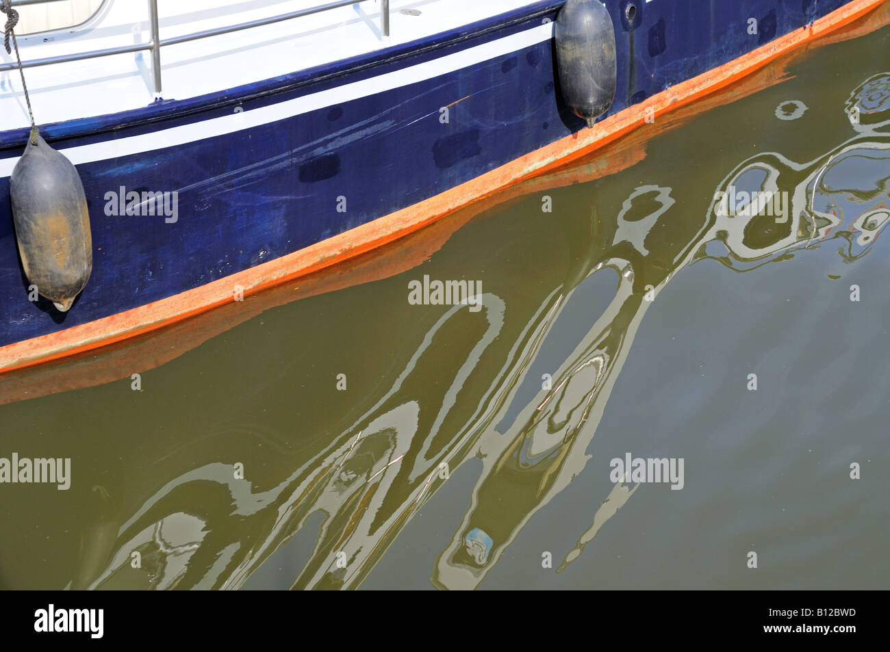Boat reflecting in Dutch canal Holland Europe Stock Photo - Alamy