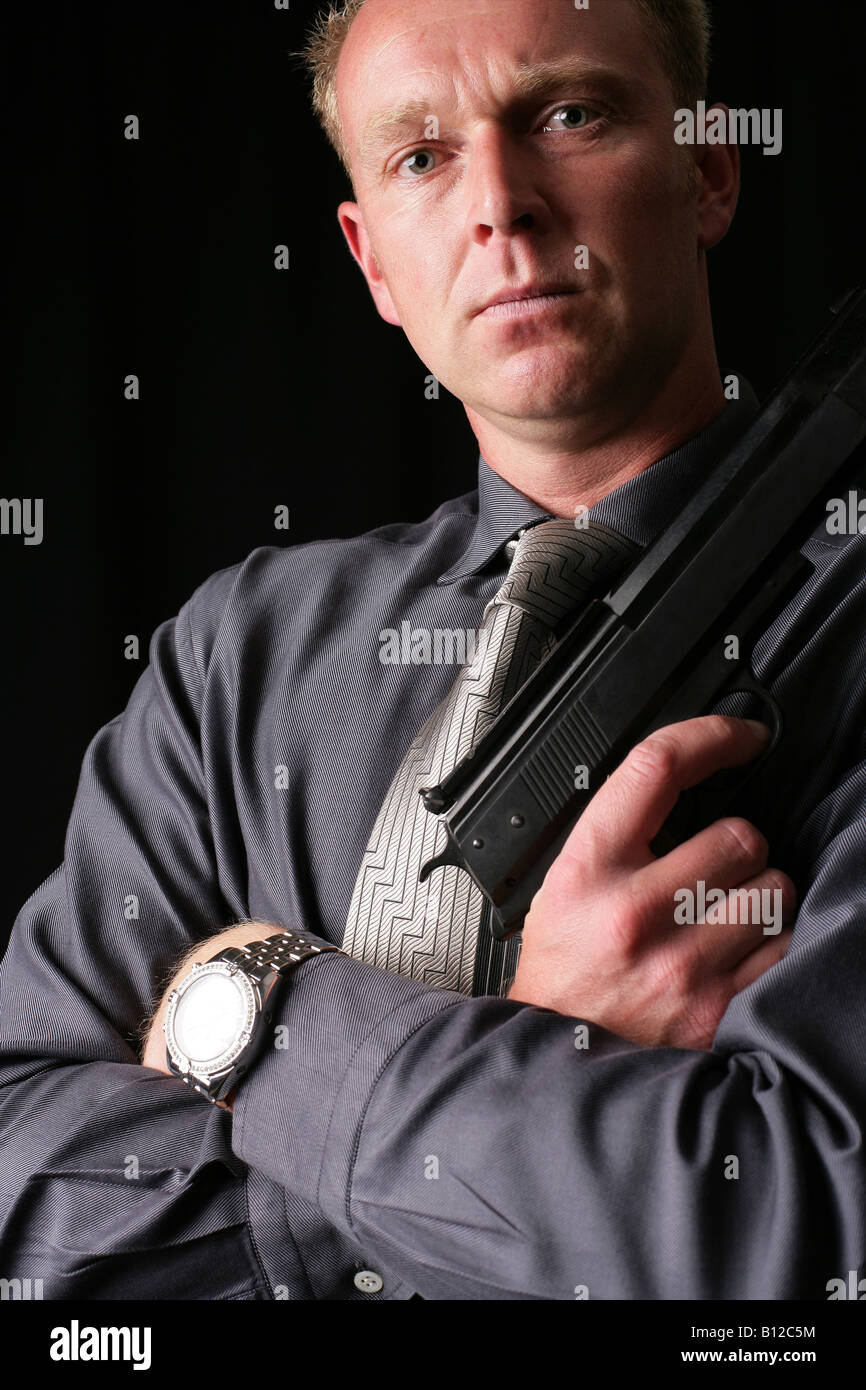 [posed by a model male 35 with an air pistol] Stock Photo