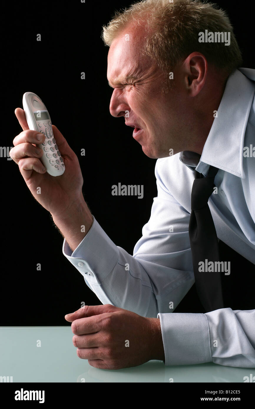Angry man on hold Stock Photo