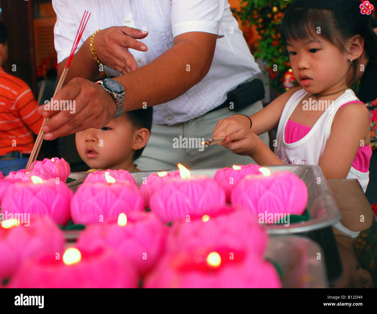 Lighting up incense on wesak festival Stock Photo Alamy