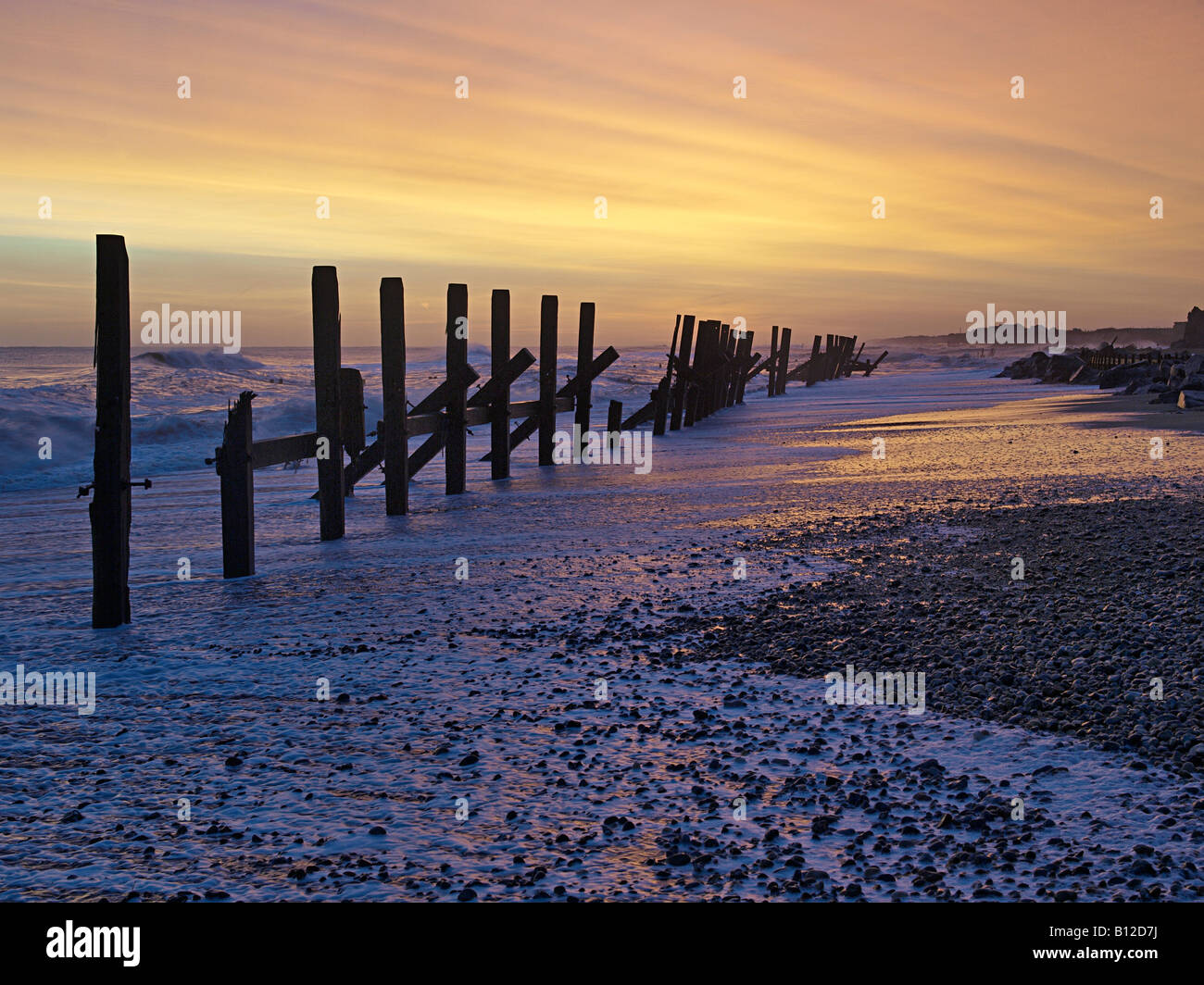 DAWN LIGHT AND SEA DEFENCES WITH SHINGLE BEACH AT HAPPISBURGH NORFOLK ...