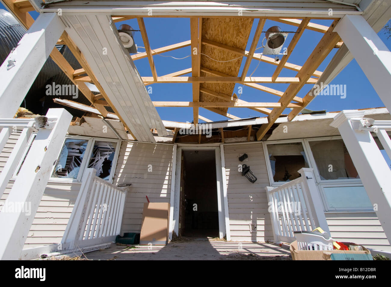 The destroyed front entrance of a home struck by a tornado near Aurora
