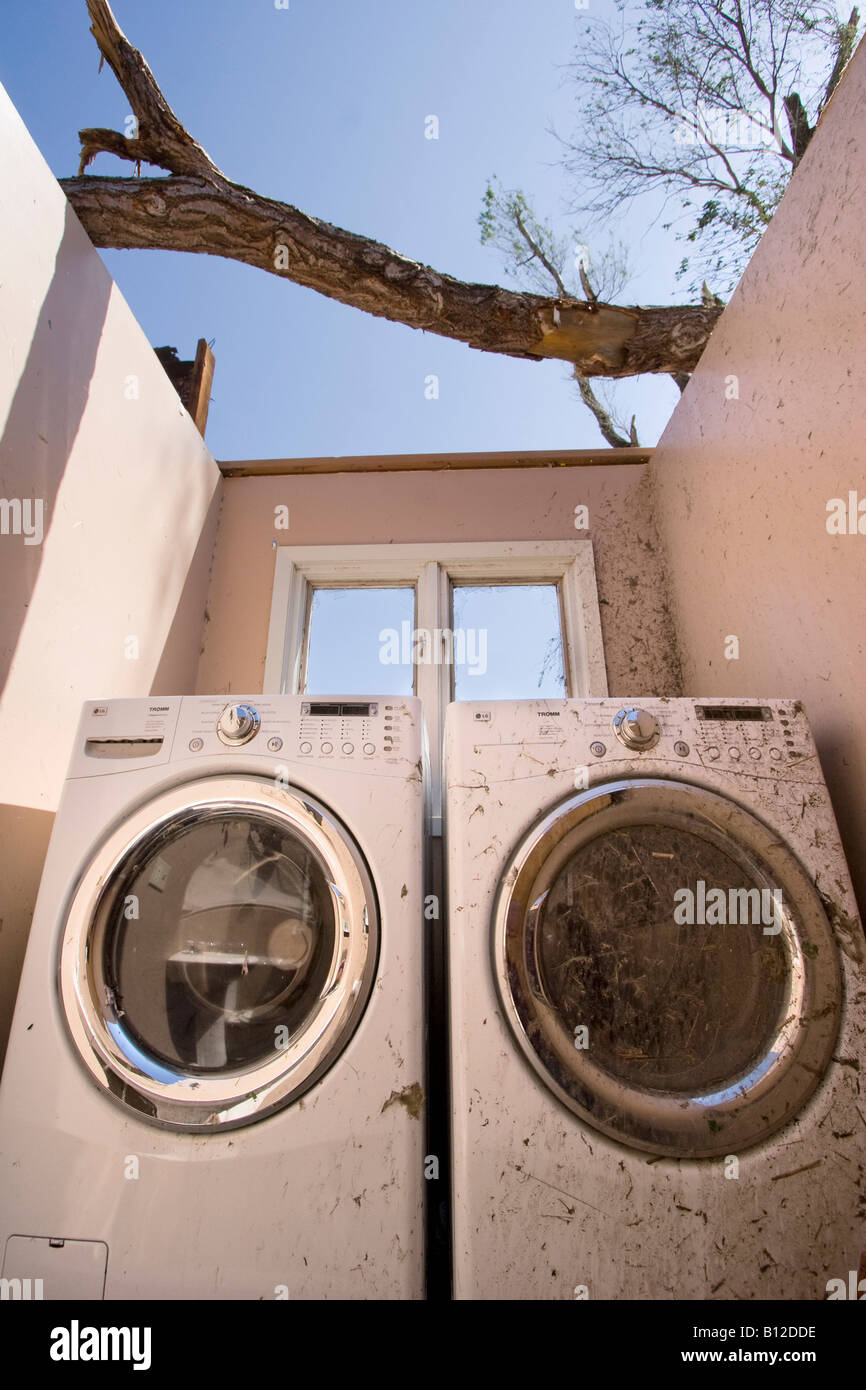 Two washing machines in the destroyed bathroom/laundry room of a home  struck by a tornado Stock Photo - Alamy
