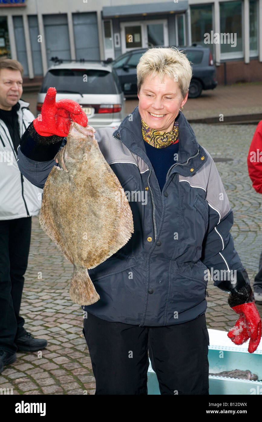 Marine biologist and lecturer from Gothenburg Ilona Miglavs with Turbot fish Psetta maxima Gothenburg Sweden 2008 Stock Photo