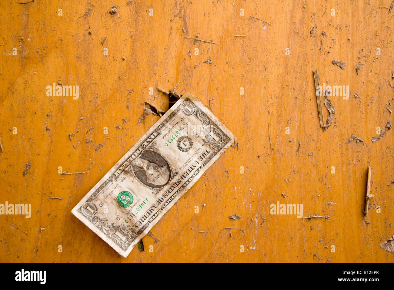 Dollar bill stuck to the door of a bathroom destroyed by a tornado in Aurora, Nebraska, USA. Stock Photo