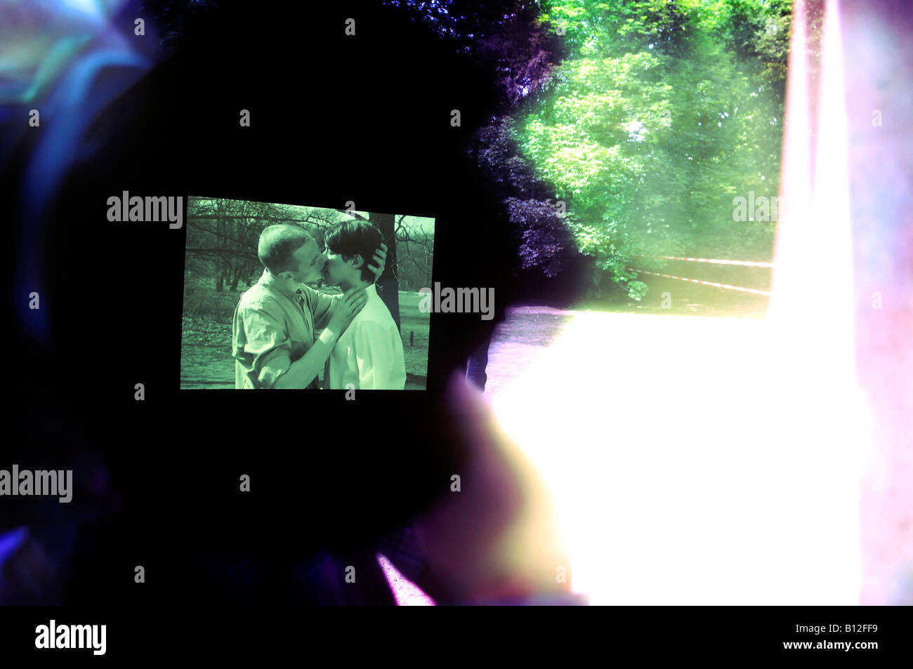 Berlin memorial to gay victims of nazis film still two men kissing Stock Photo