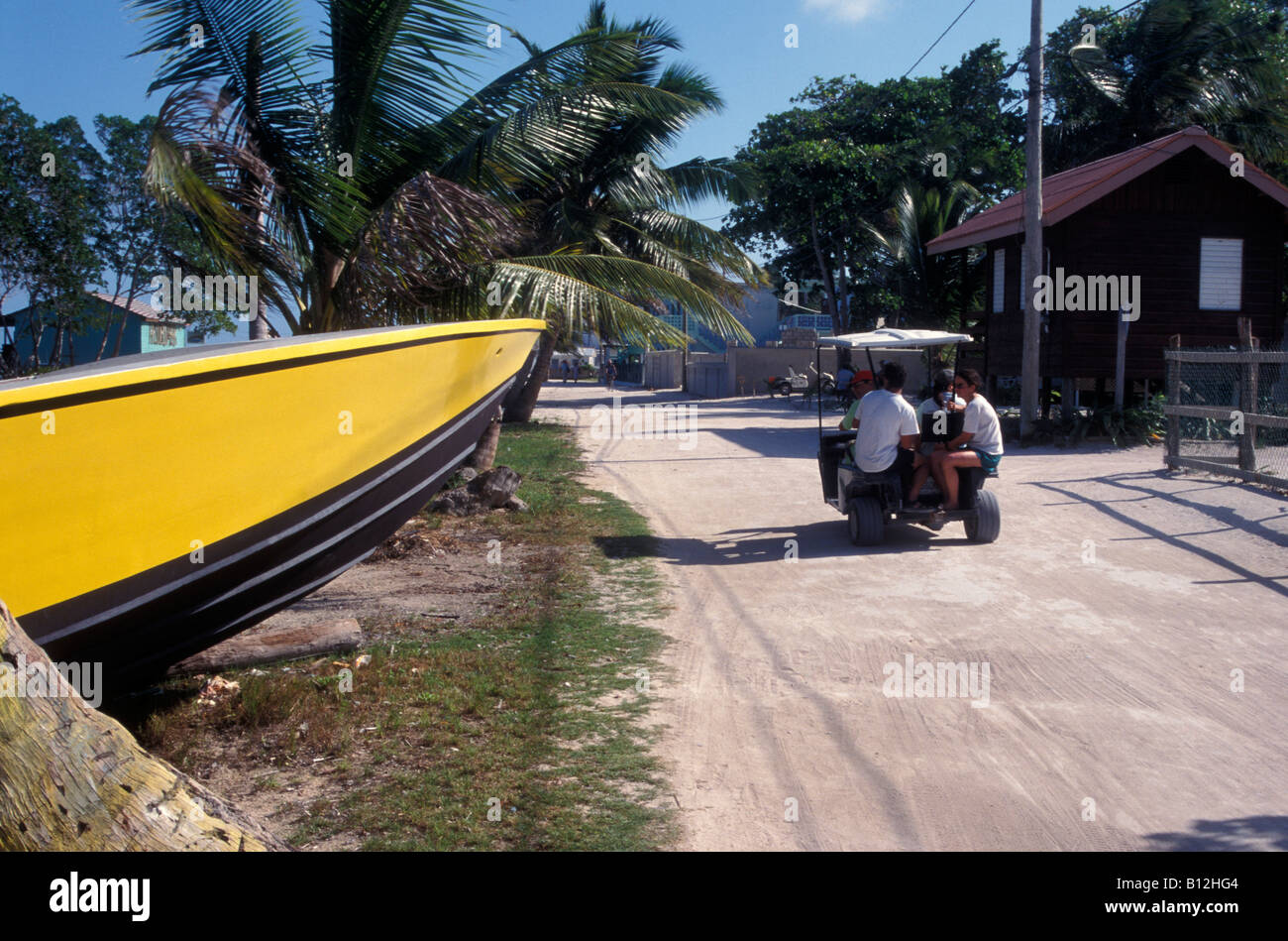 Golf carts on Caye Caulker' sandy main street, Belize Stock Photo Alamy