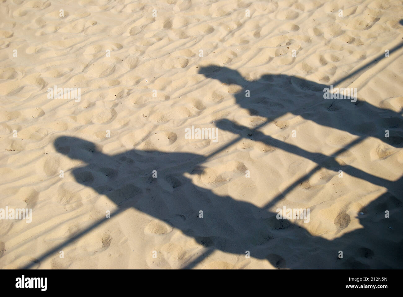 Shadows on beach sand, The Esplanade, Weymouth, Dorset, England, United Kingdom Stock Photo