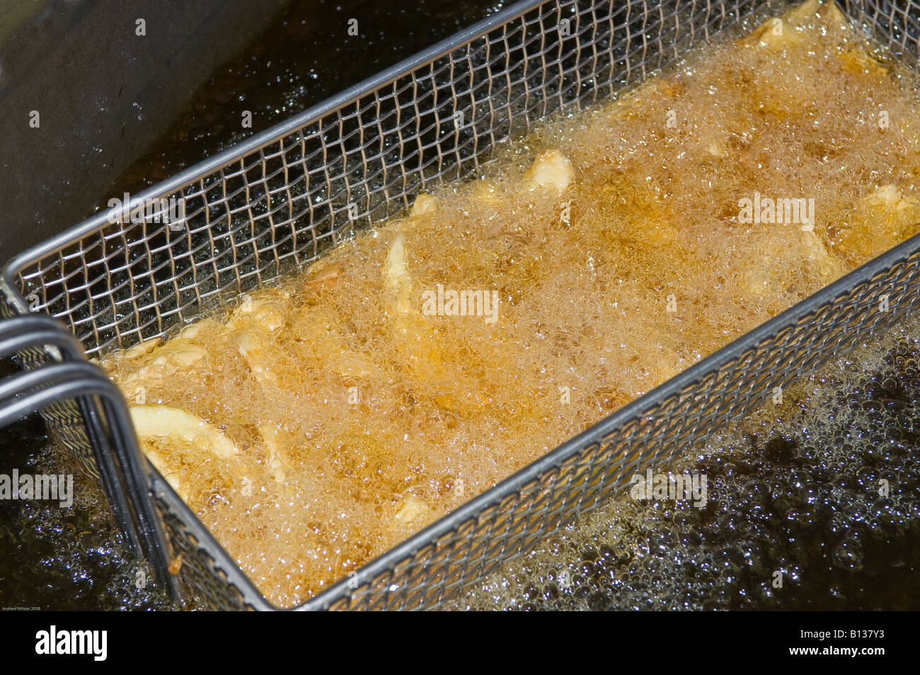 Chips in Deep Fat Fryer Stock Photo