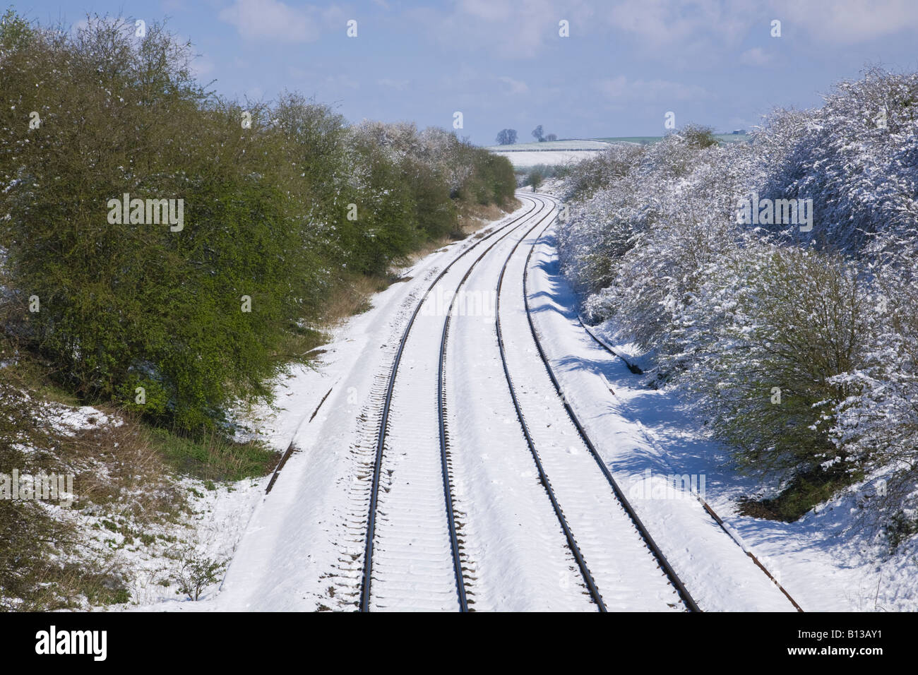 Rail track in the snow between Tackley and Lower Heyford Oxfordshire England Stock Photo