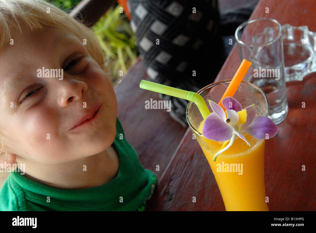 Happy Wilf after drinking orange juice, Kao Lak, Thailand Stock Photo