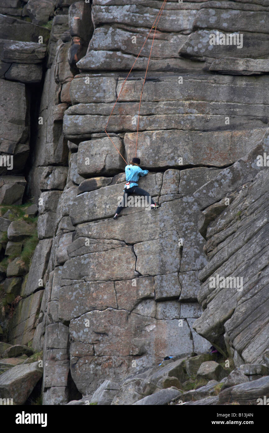 Climber on Stanage Edge in Derbyshires Peak District Stock Photo