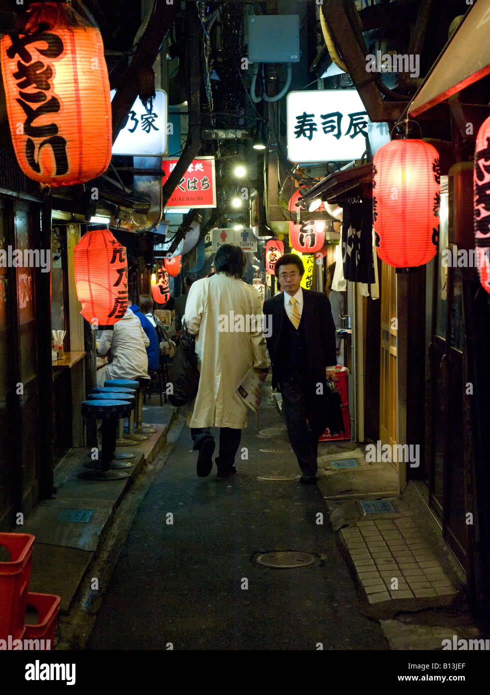 Narrow alley with red lanterns at Shomben Yokocho area full of bars and restaurants in Shinjuku Tokyo Japan Stock Photo