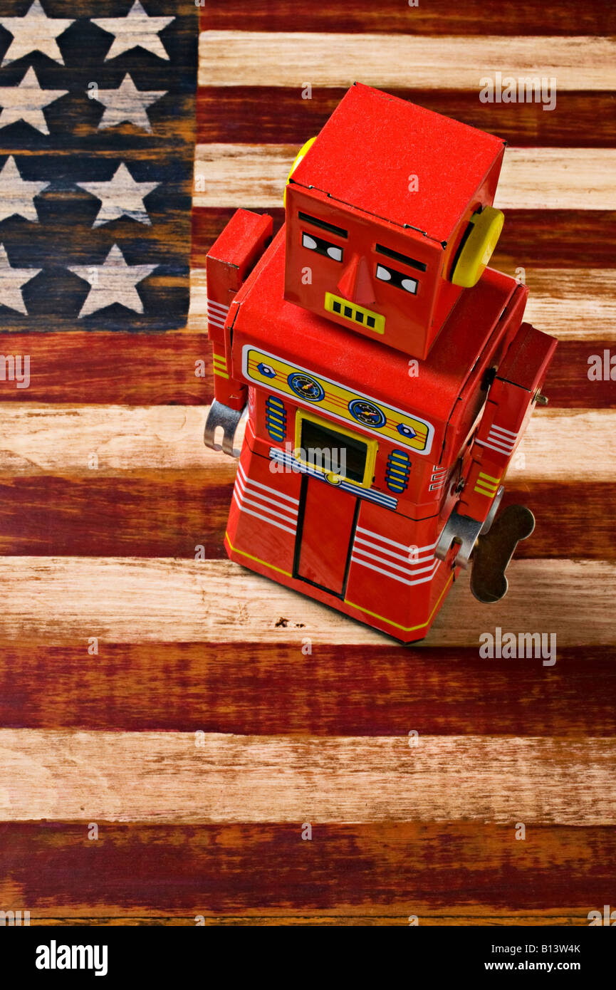 Toy robot on wooden American folk art flag Stock Photo