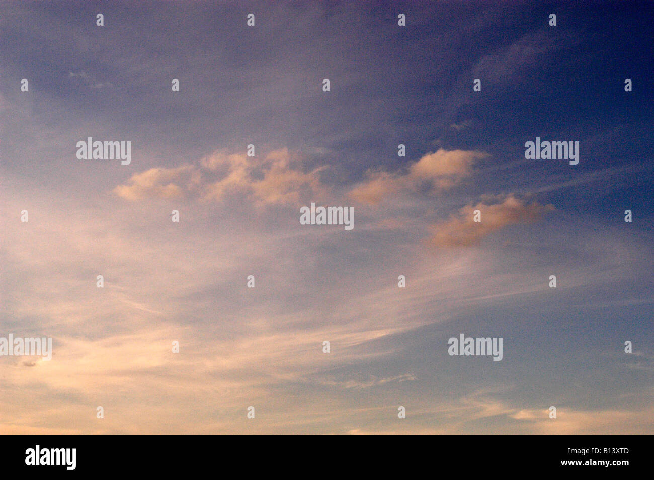 CIRRUS CLOUDS IN EVENING SKY Stock Photo