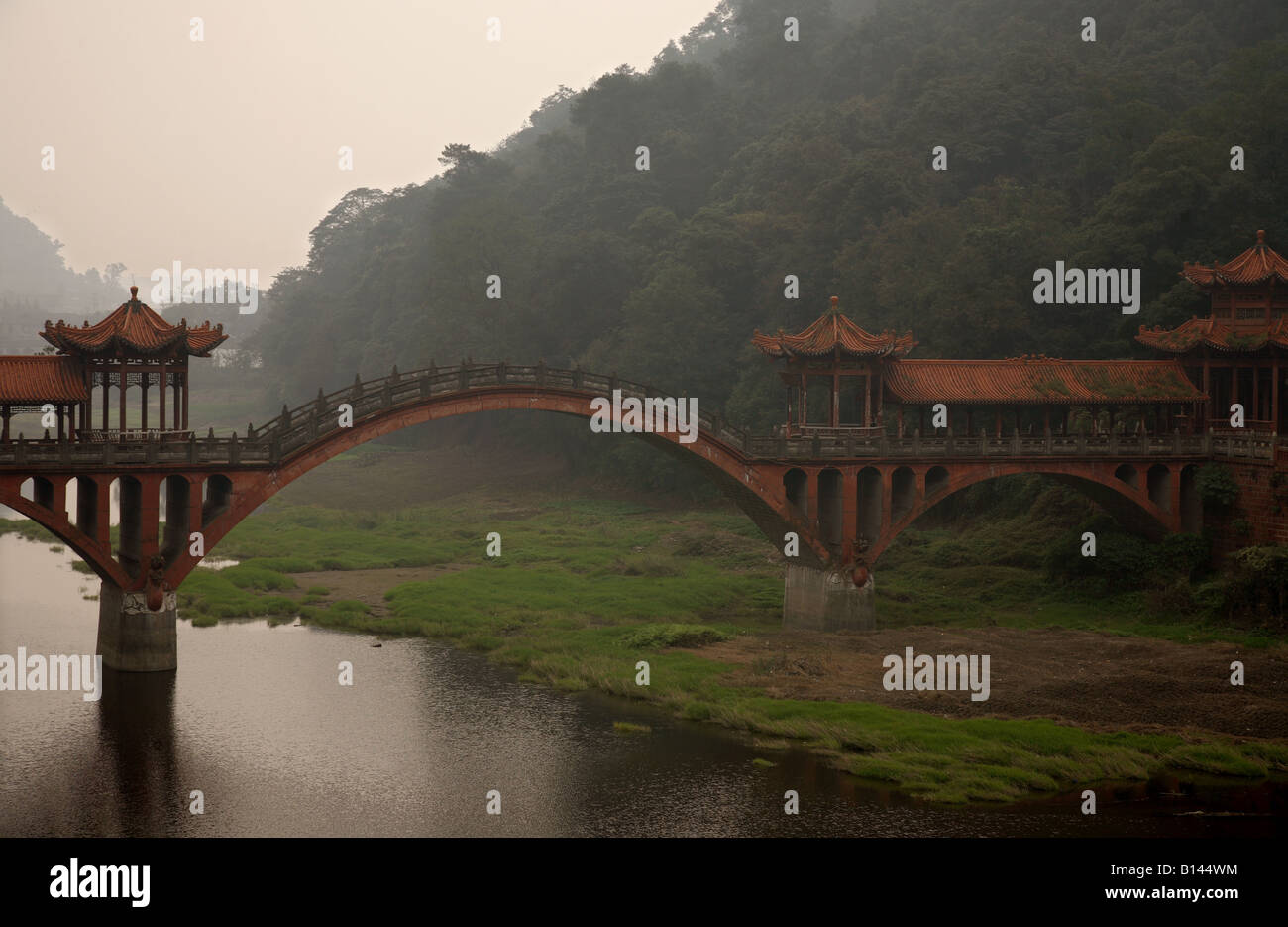 A Chinese bridge over a river in Leshan close to the Giant Buddha tourist attraction Stock Photo