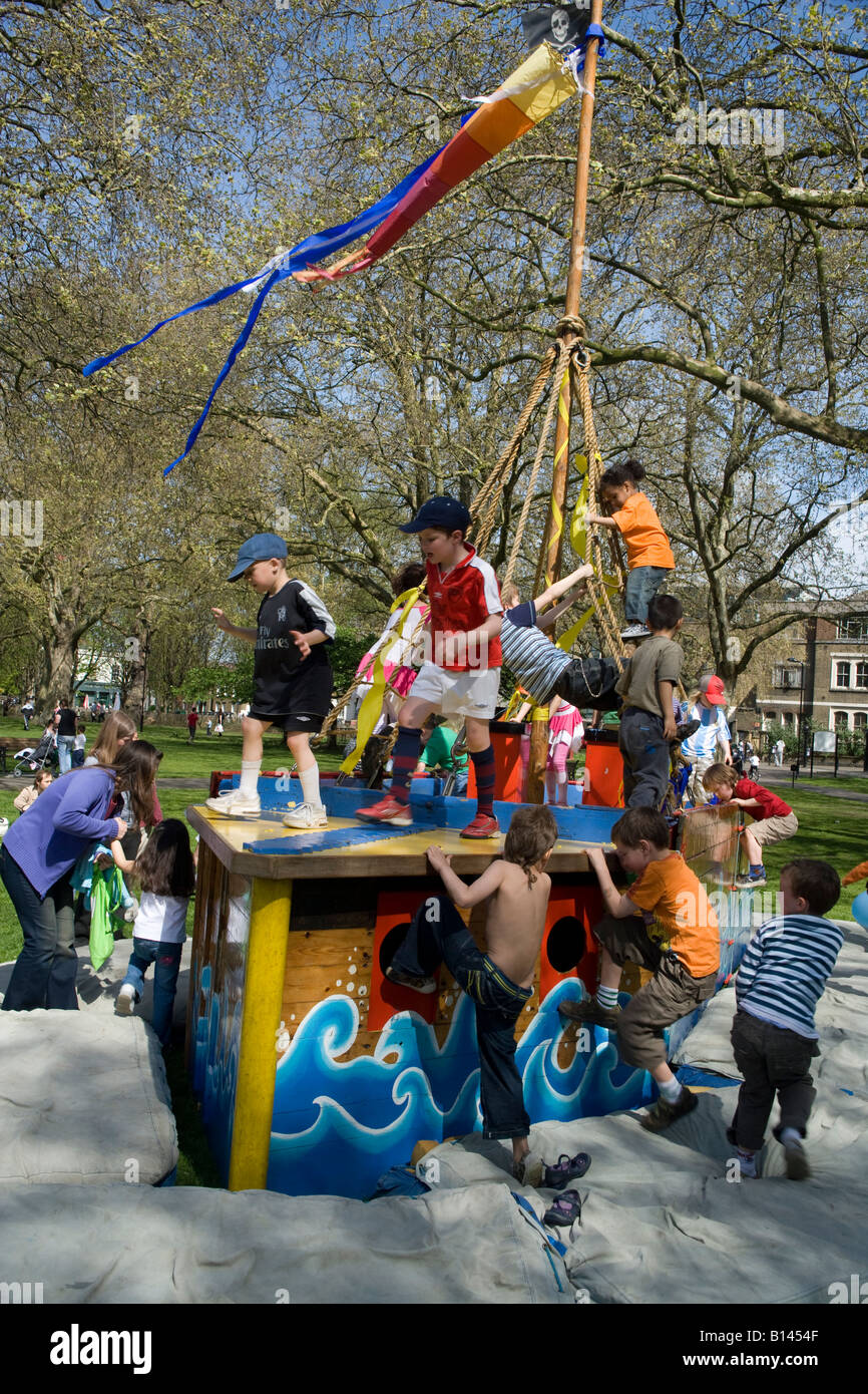 People Spring children  london fields park pirates playing Stock Photo