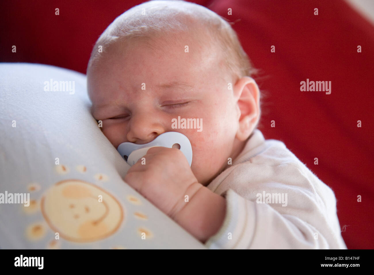baby sleeping with comforter Stock Photo Alamy