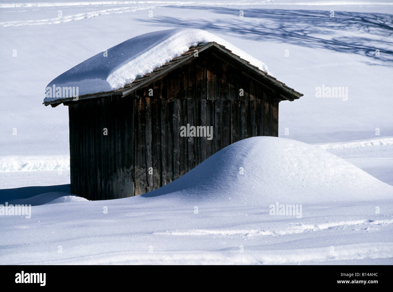 mountain hut covered in snow in the swiss alps Stock Photo - Alamy