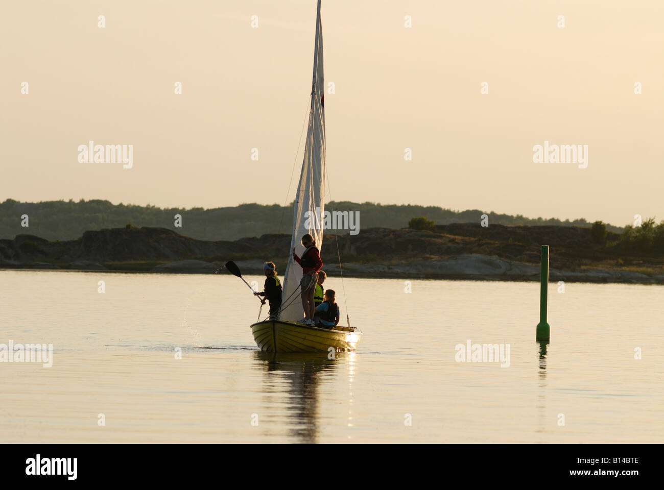Sailing boat at dusk, Sweden, west coast Stock Photo