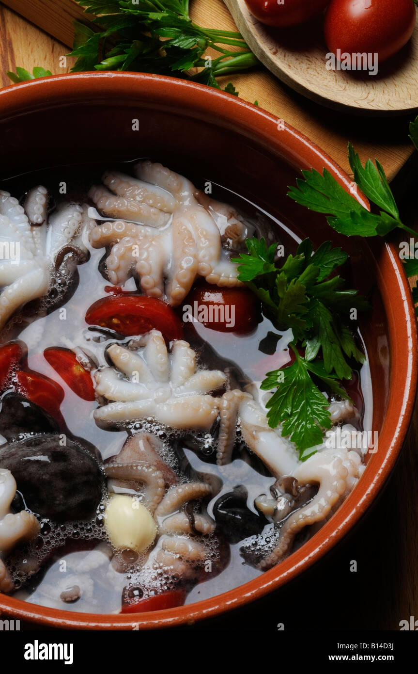 Poached octopus - Purpetielli affugati - Napoli Campania - Polipetti affogati Italian kitchen Stock Photo