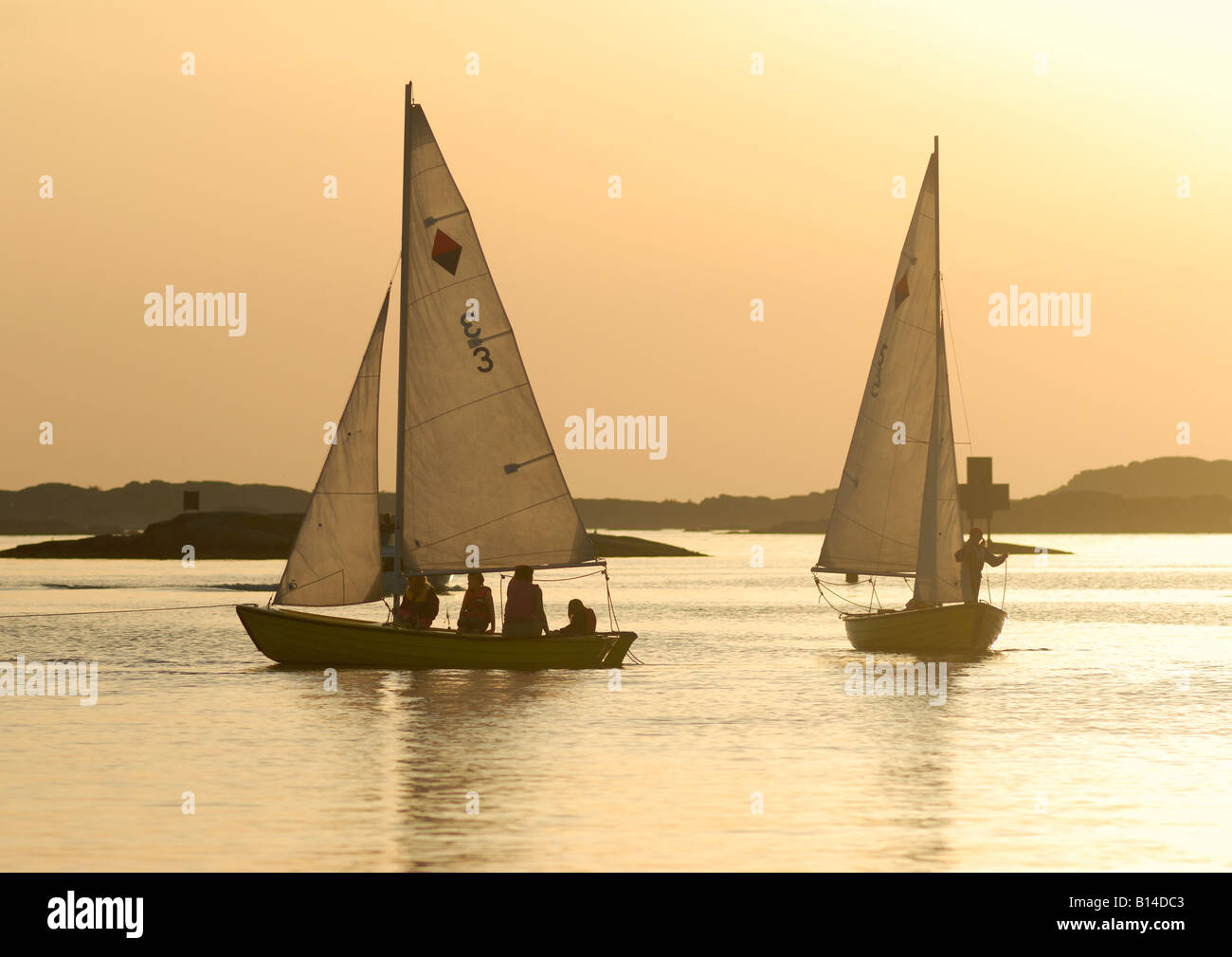 Two sailing boats at dusk, Sweden, west coast Stock Photo