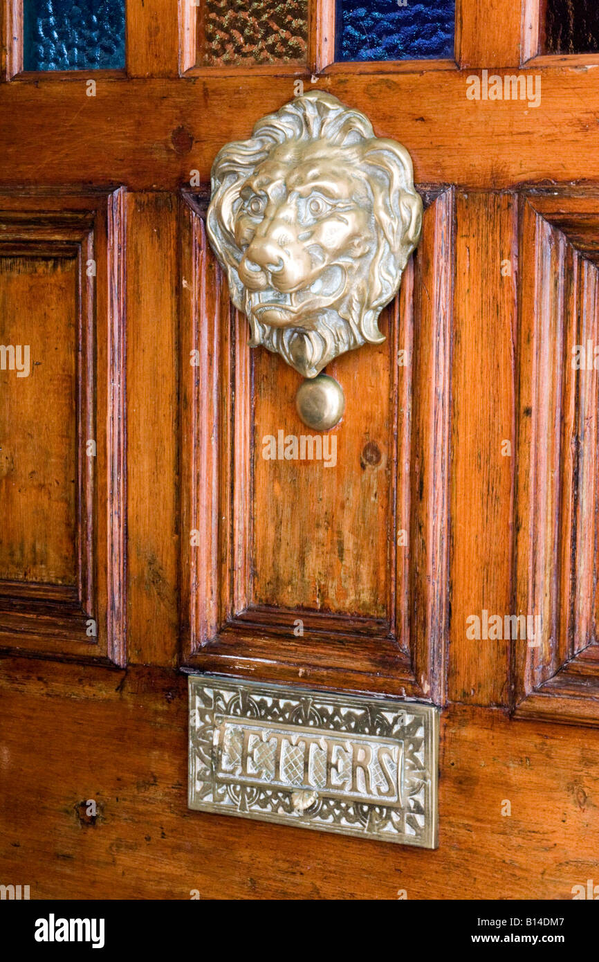 door knocker of a lions head and brass letterbox at Pub door in cornwall, UK Stock Photo Alamy