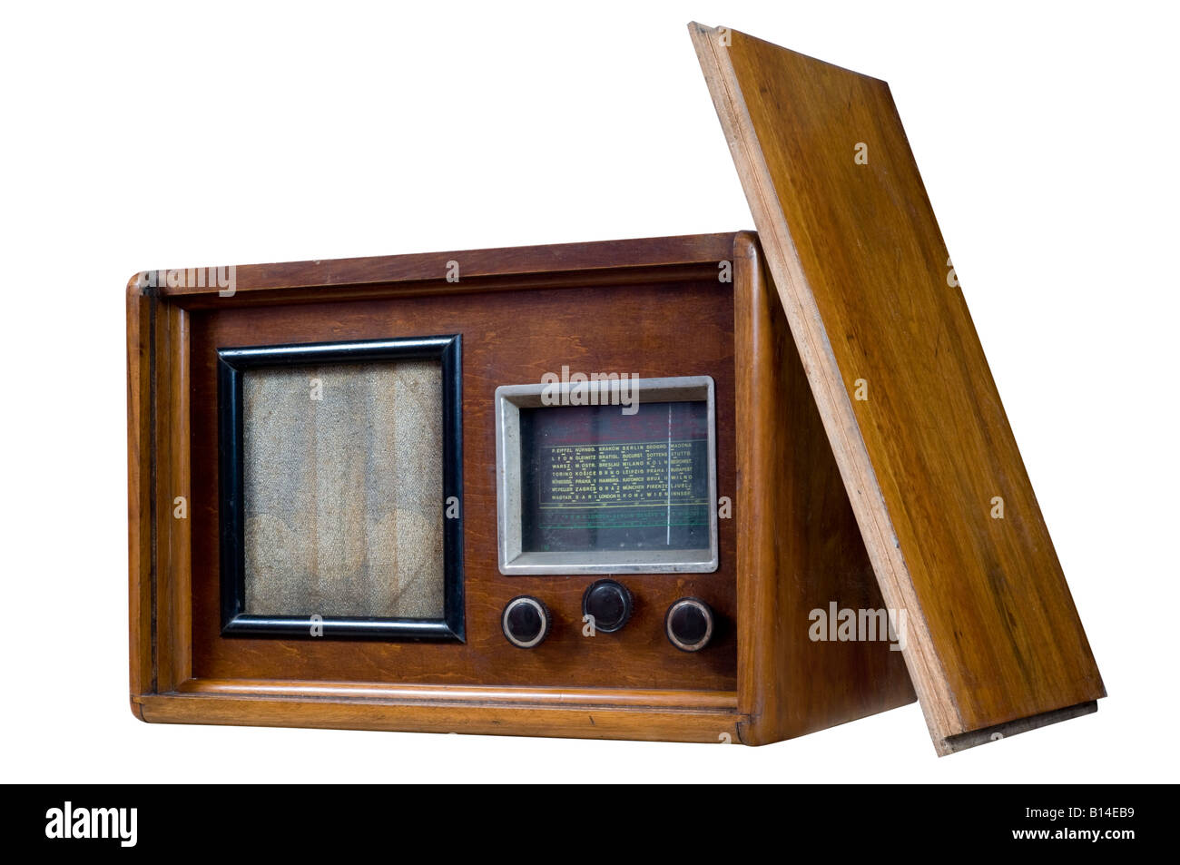 Old wooden radio with front cover on white background. Stock Photo