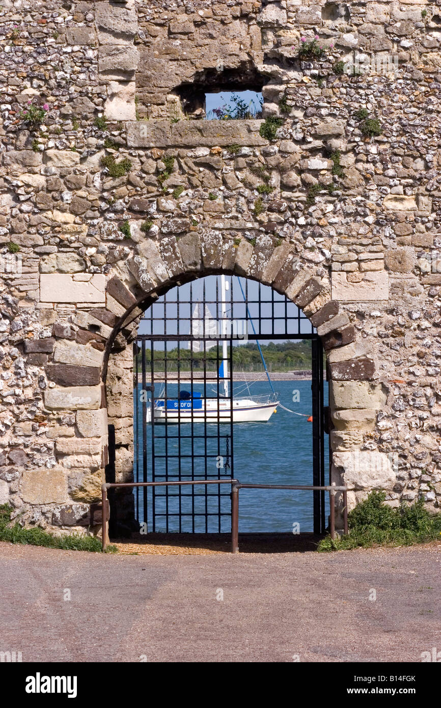 A yacht visible through a castle gate Stock Photo