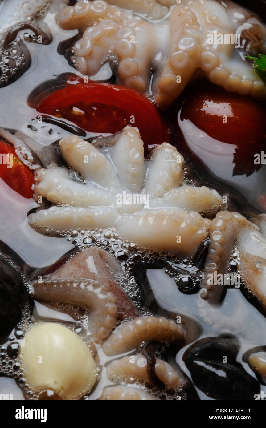 Poached octopus - Purpetielli affugati - Napoli Campania - Polipetti affogati Italian kitchen Stock Photo