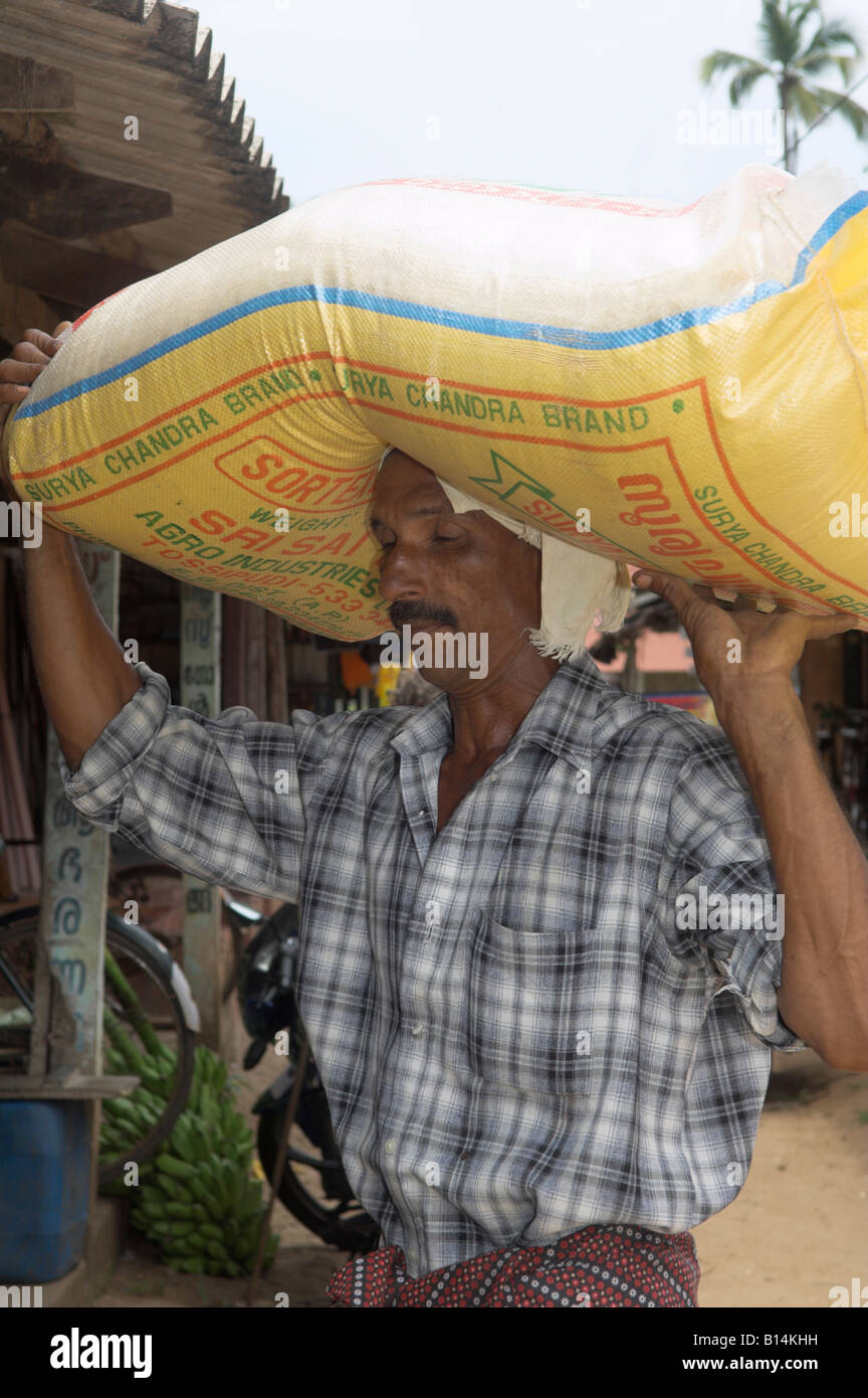 Man carrying sack rice on hires stock photography and images Alamy
