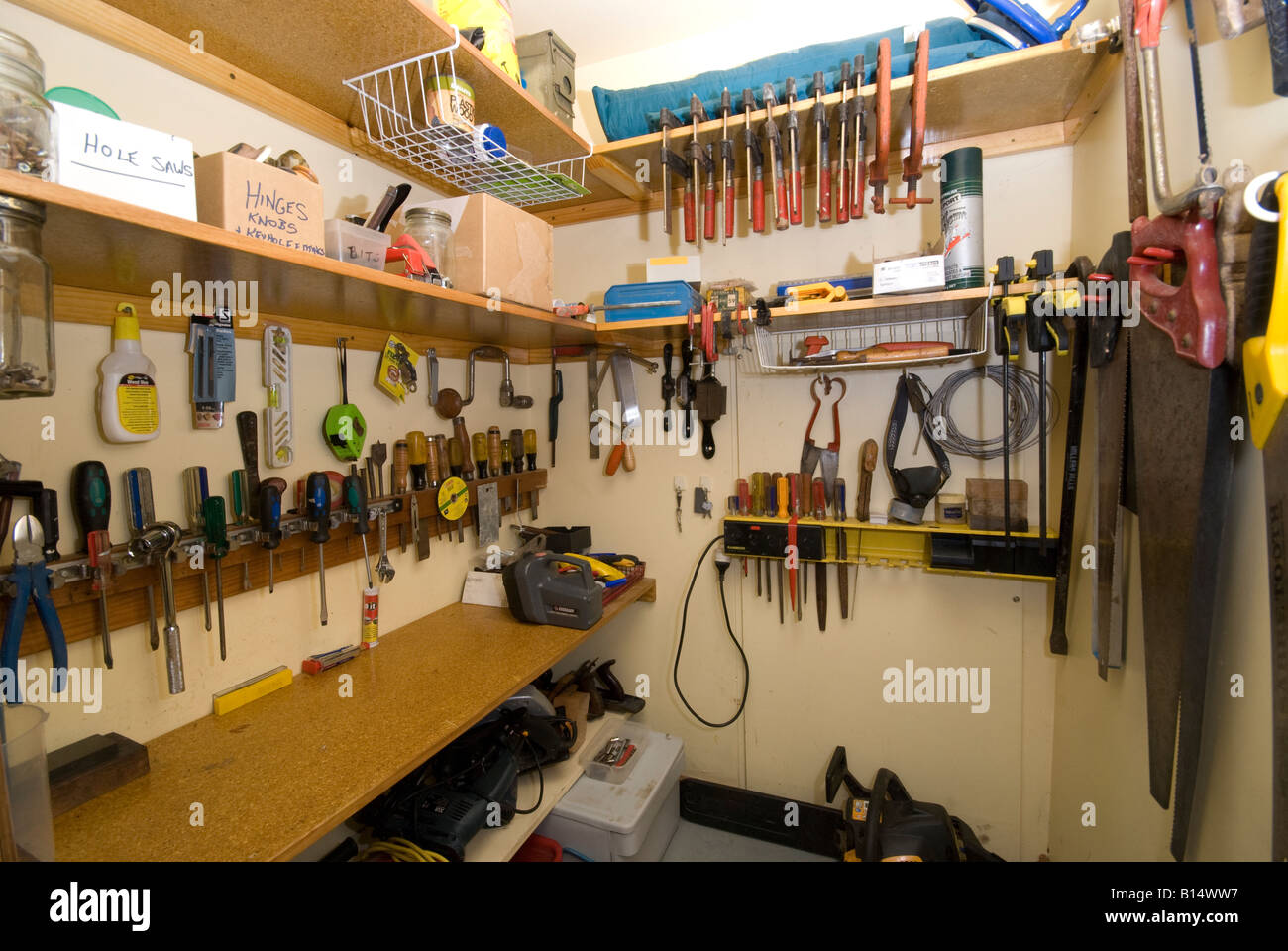 A well ordered small workshop with tools displayed in an orderly fashion Stock Photo
