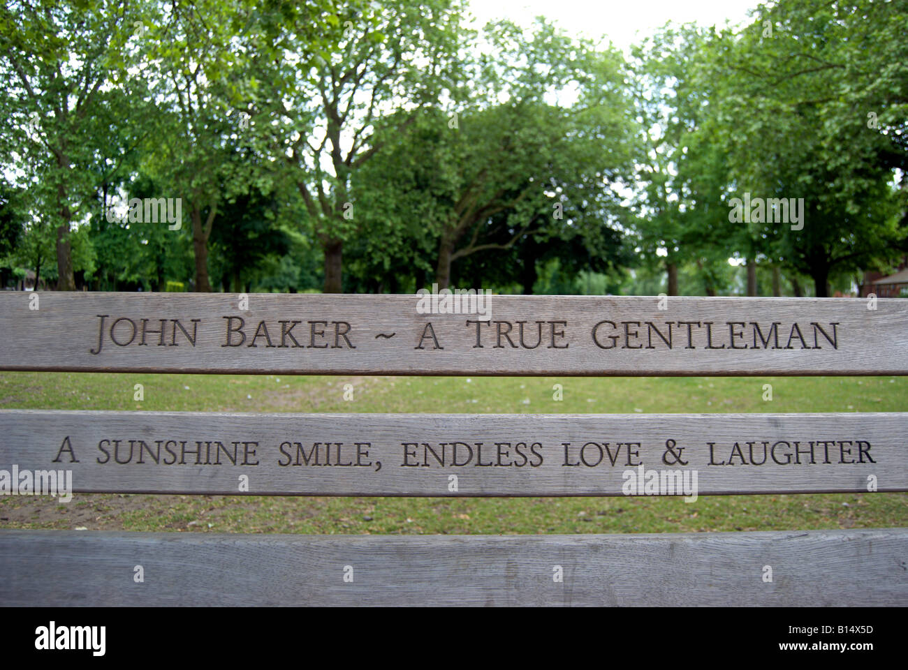 inscription on memorial bench on barnes green, southwest london, england Stock Photo