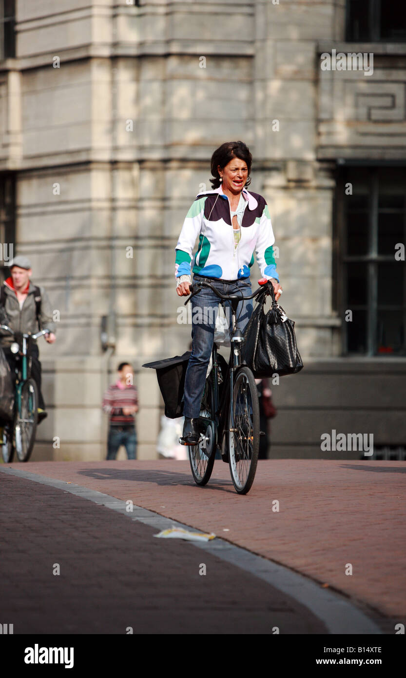 Tourist cycling through Amsterdam Stock Photo Alamy
