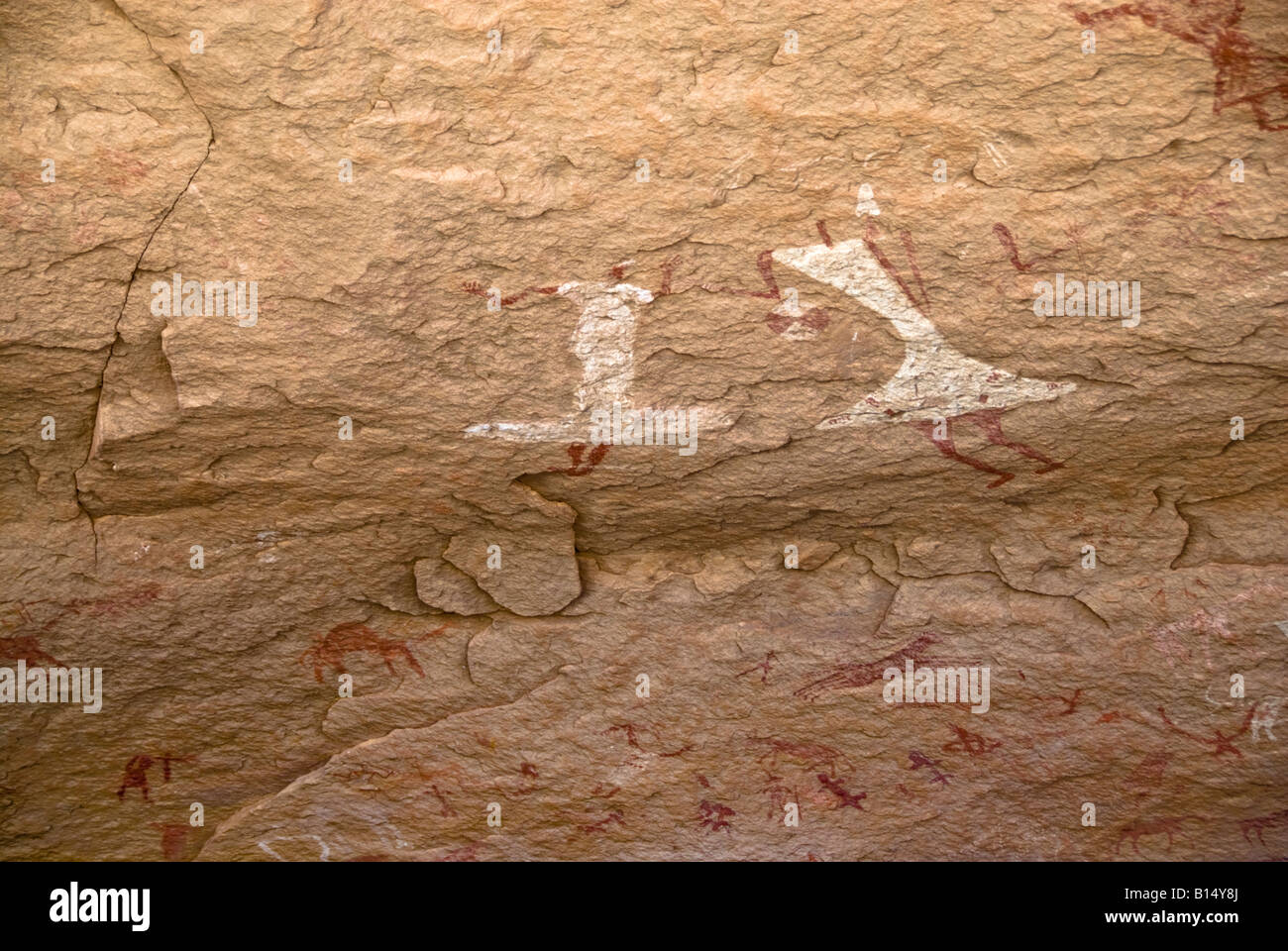 Pin-head 'dancing girls' rock art, Takdhalt site, Wadi Teshuinat, Tadrart Acacus, Libyan Sahara Stock Photo