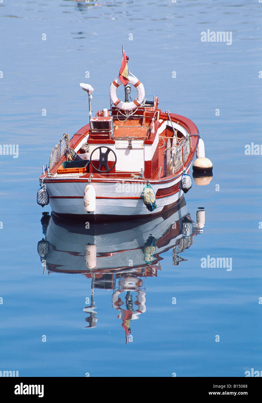 Boat and its reflection on water. Finisterre. La Coruña province. Galicia. Spain. Stock Photo