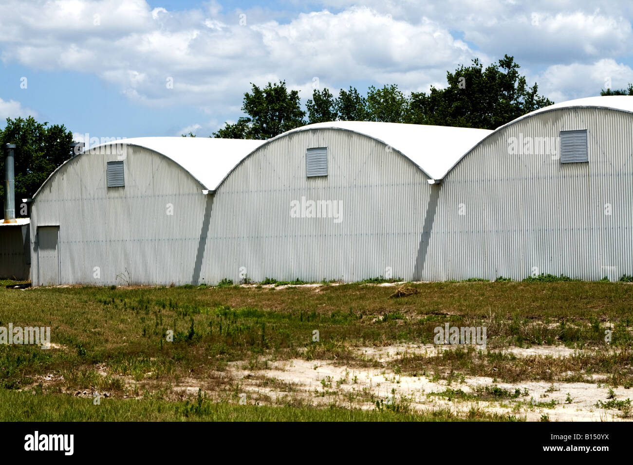 Three white covered greenhouses near Orlando, Florida Stock Photo
