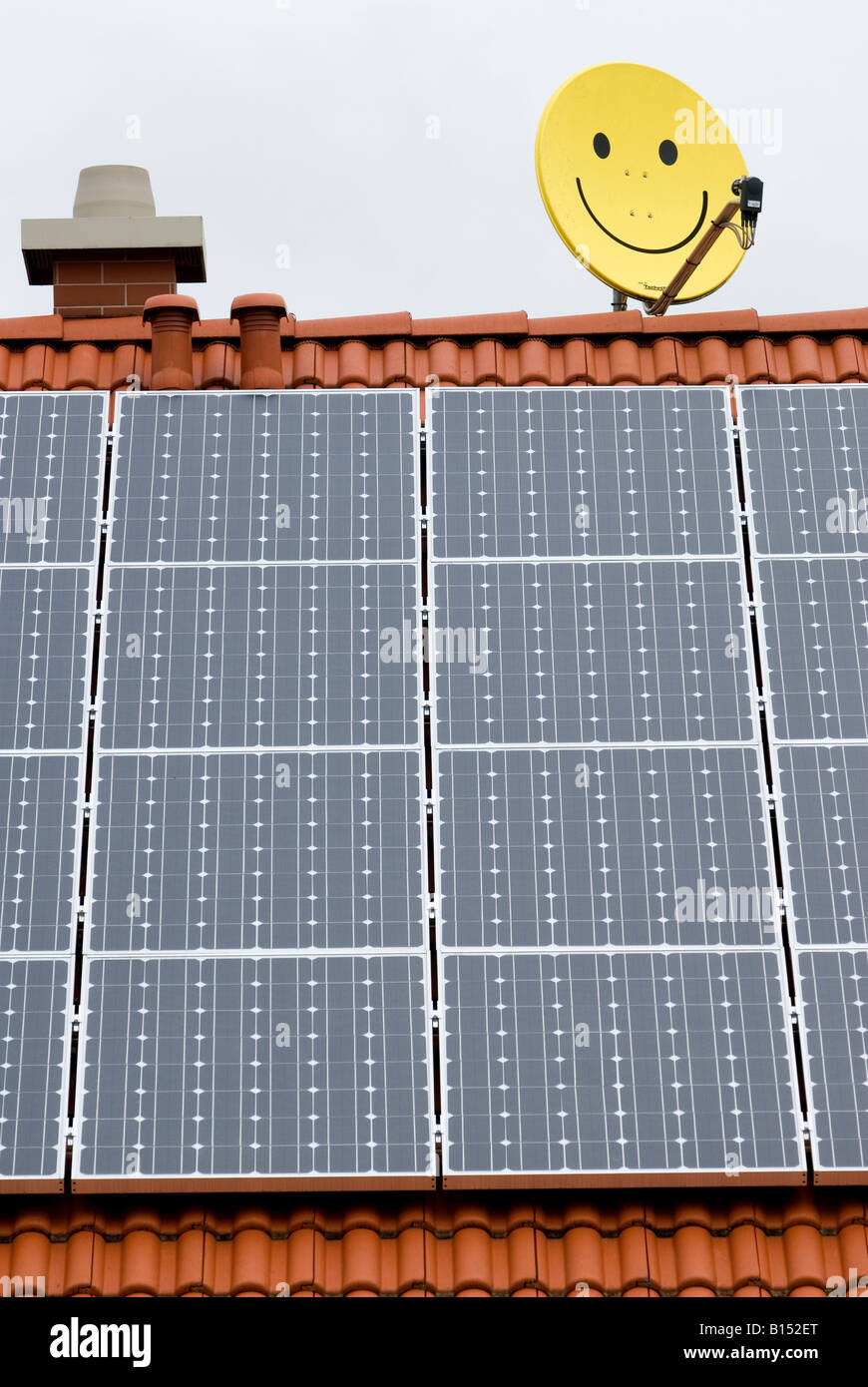 Solar panels fitted to the roof of a house in the village of Marktl near Altutting, Bavaria, Germany. Stock Photo
