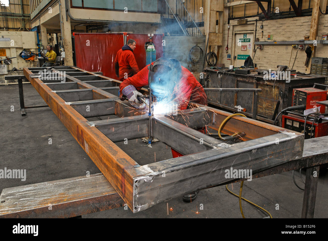 Metal workers in a factory Stock Photo
