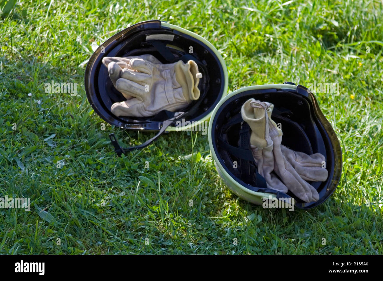 Helmets and gloves of the firefighters Stock Photo Alamy