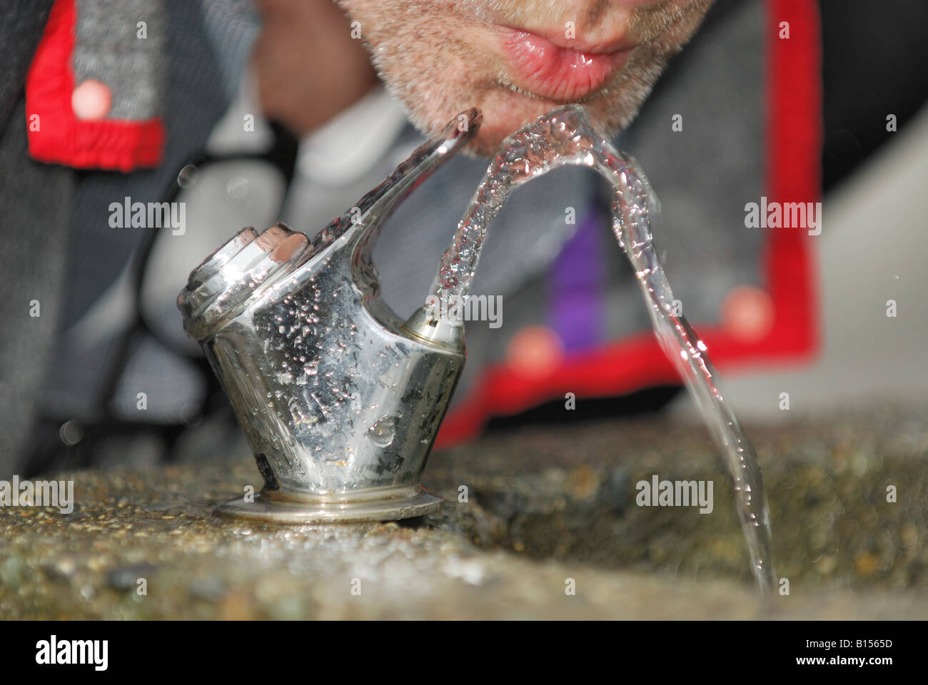 Man about to Drink from a Water Fountain Stock Photo Alamy