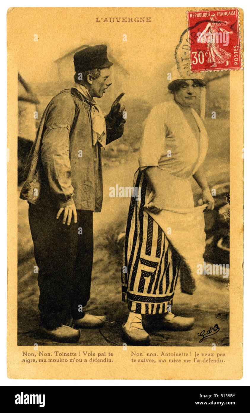 French humour picture postcard of peasant couple (man scolding wife) from the Auvergne region - 1935 Stock Photo