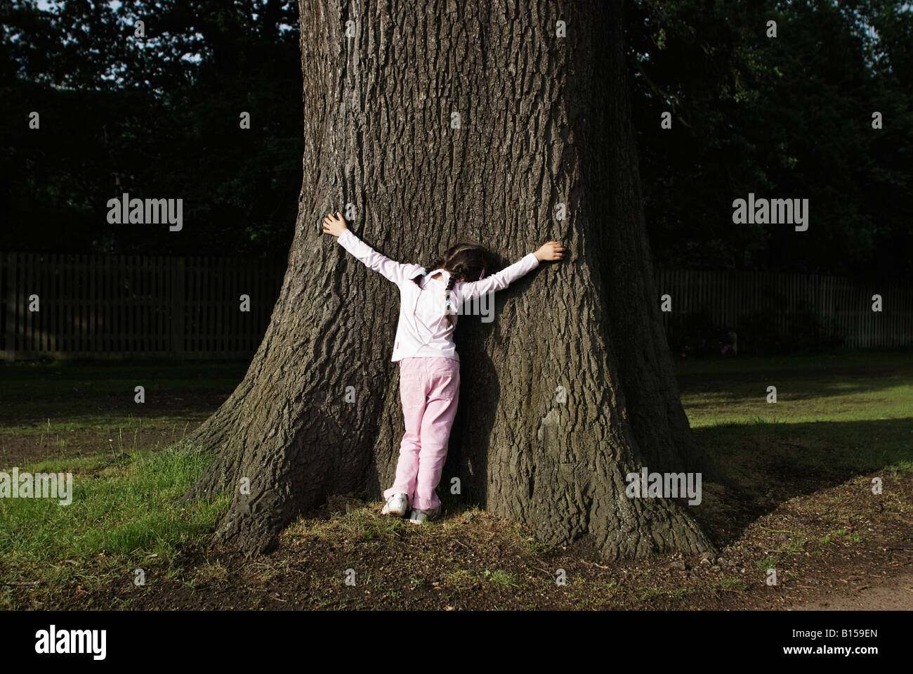 Child park tree hi-res stock photography and images - Alamy