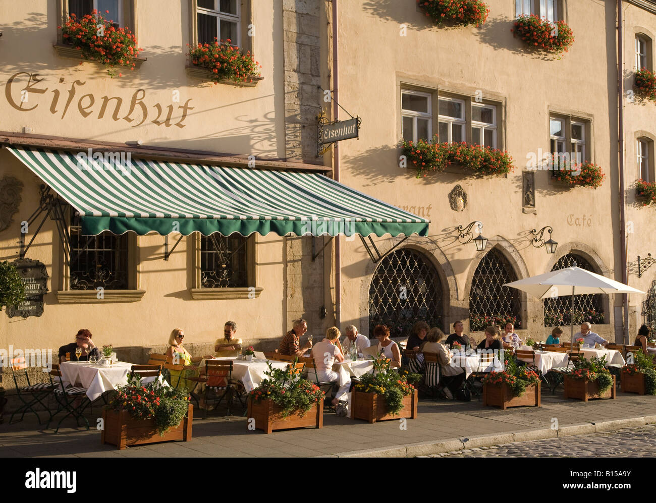 People eating and drinking in pavement restaurant Rothenburg Germany Stock Photo