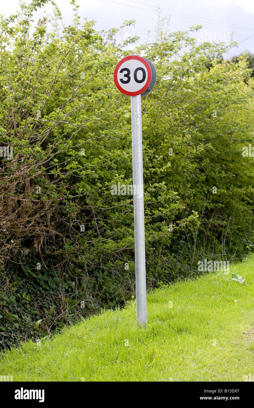 30 mph roadsign on a quiet country lane Stock Photo