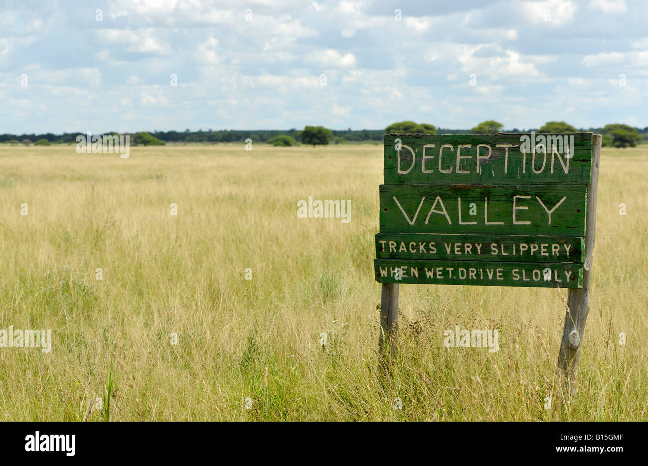 flat landscape with grass and sign Deception Valley CENTRAL KALAHARI ...