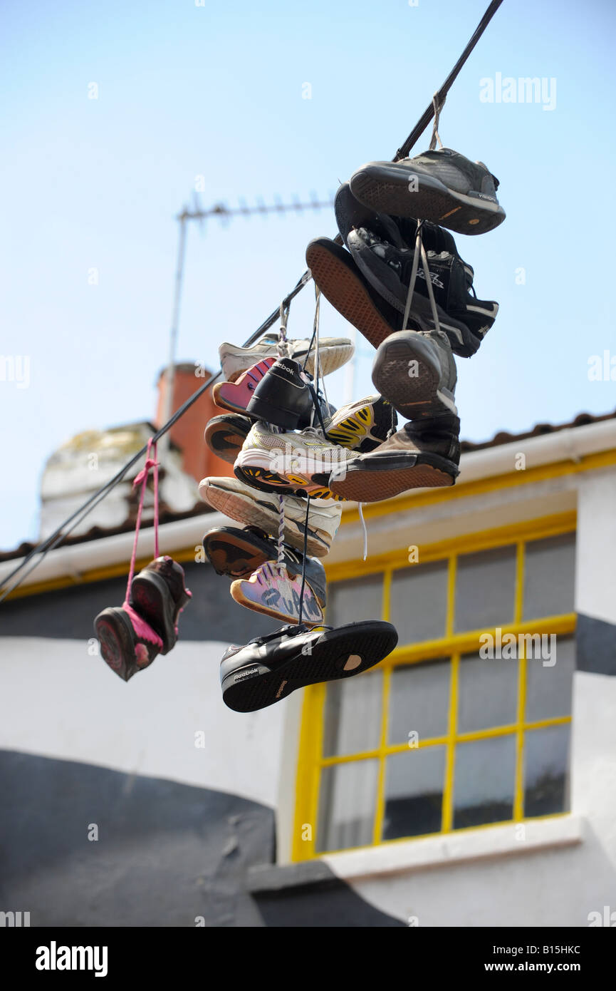 Shoes hanging from power lines in the North Laine district of Brighton, East Sussex. Picture by Jim Holden. Stock Photo